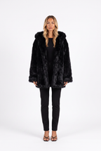 Oversized shaggy faux fur hooded coat in black — front
