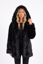 Oversized shaggy faux fur hooded coat in black — hood up detail
