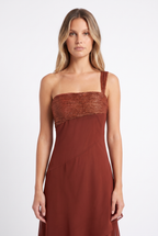 Rust one-shoulder tiered chiffon maxi dress — bandeau and strap detail