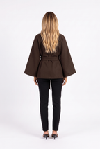Dark brown belted cape jacket with funnel collar — back