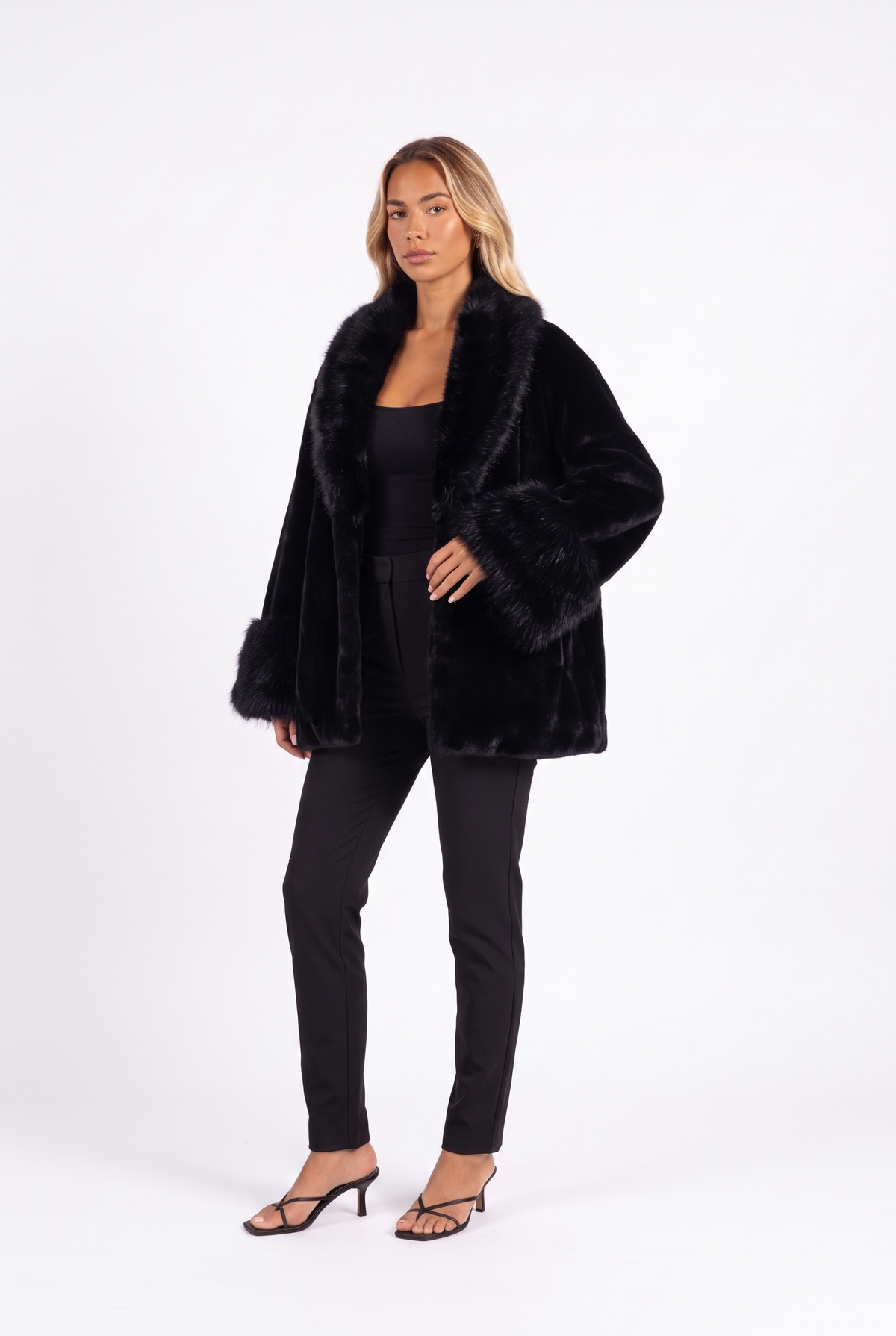 Black oversized faux mink coat with fluffy fur collar and cuffs — three-quarter