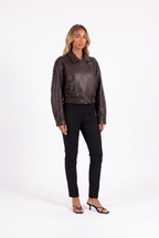 Brown faux-leather cropped belted moto jacket — three-quarter