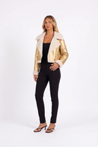 Metallic gold faux-leather cropped moto jacket with faux shearling trim — three-quarter