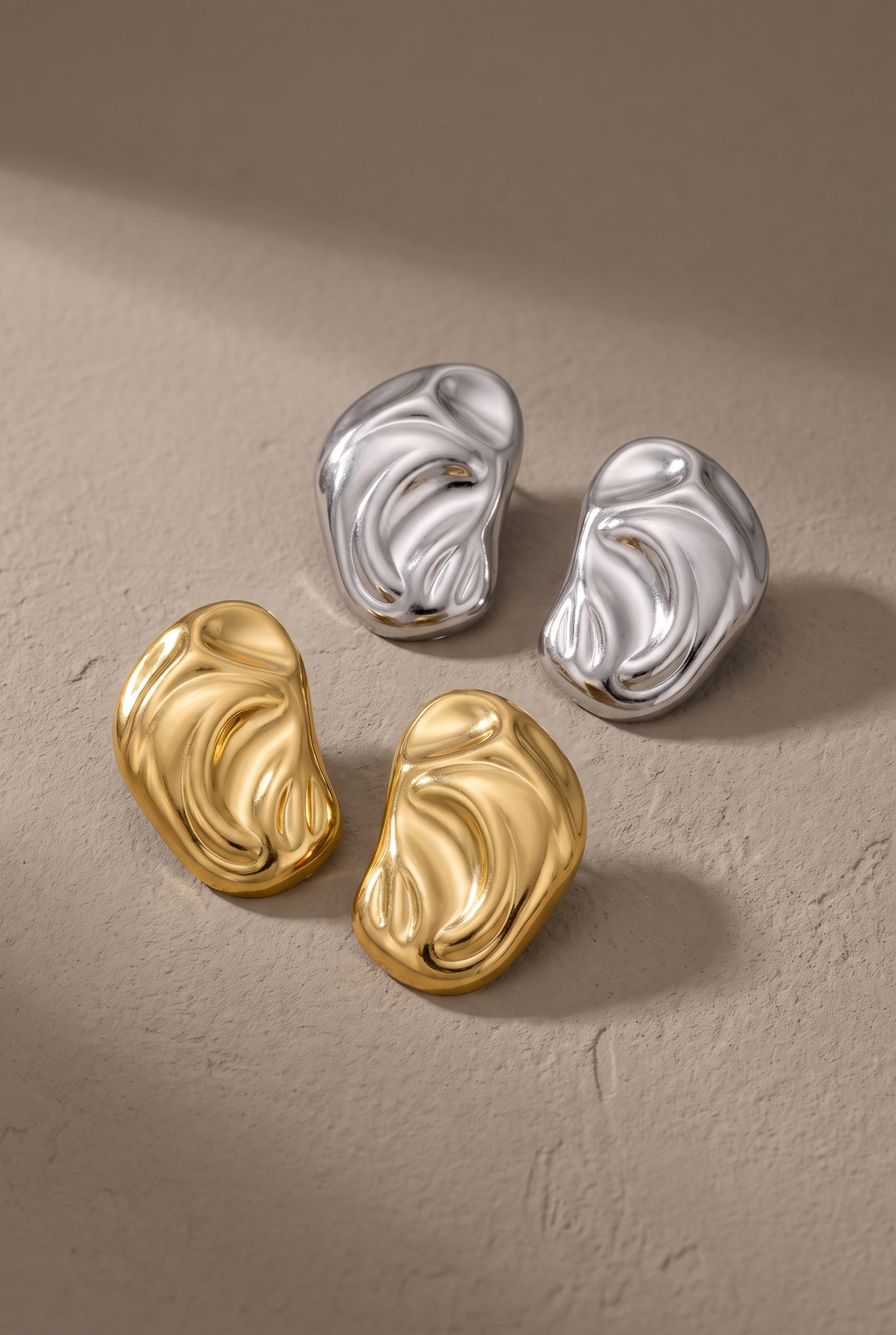 DropIQ molten bean stud earrings in polished gold and silver