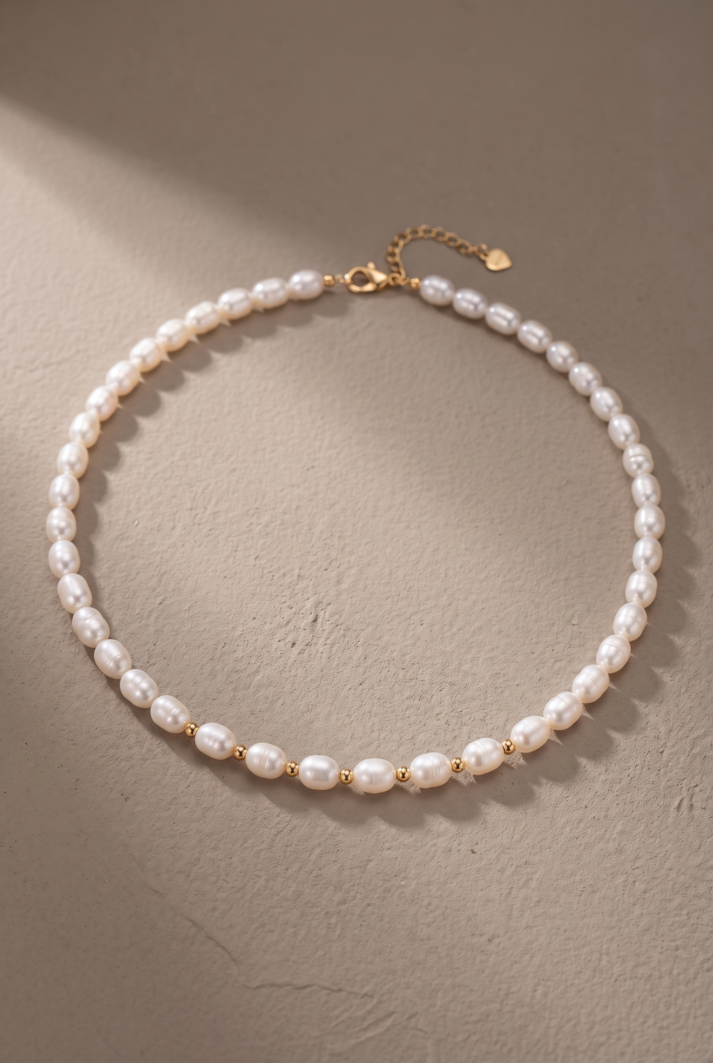 DropIQ white rice pearl strand necklace with gold spacer beads