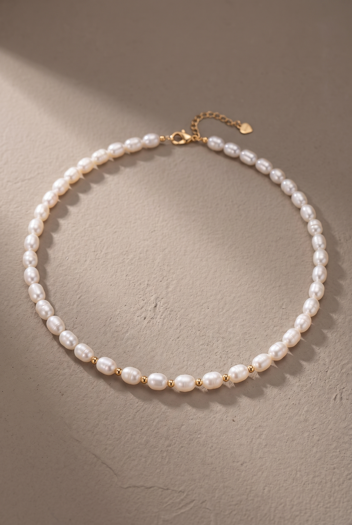 DropIQ white rice pearl strand necklace with gold spacer beads