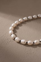 Close-up of the 8-9 mm baroque pearls and tiny black spacers
